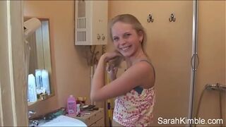 Sweet Sarah strip off her clothes and showing natural tits and shaved pussy. She Fingering her pussy deeply in comport room