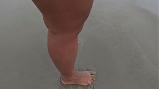 Foot fetish with dirty, wet and bare feet on the street